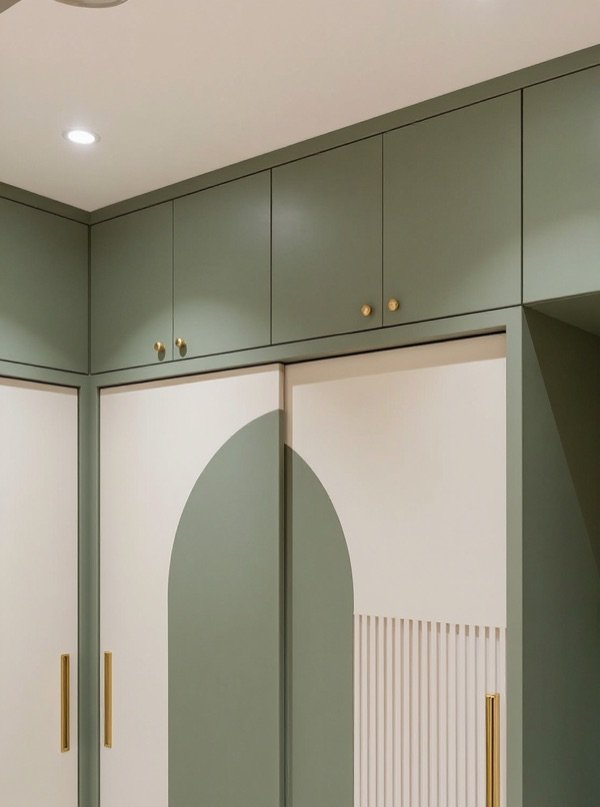 Loft units above a fitted wardrobe for overhead storage